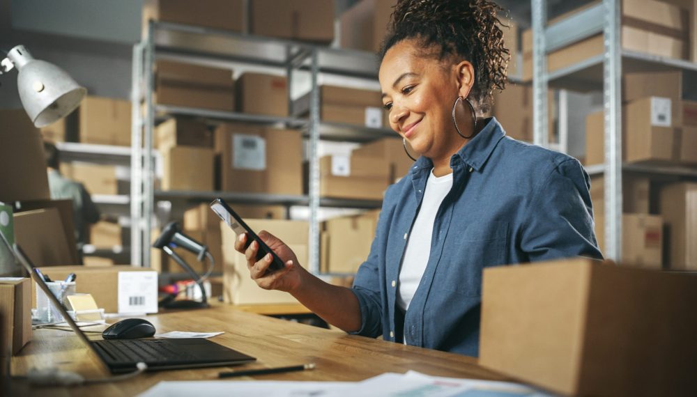 Inventory,Manager,Using,Smartphone,To,Scan,A,Barcode,On,Parcel,