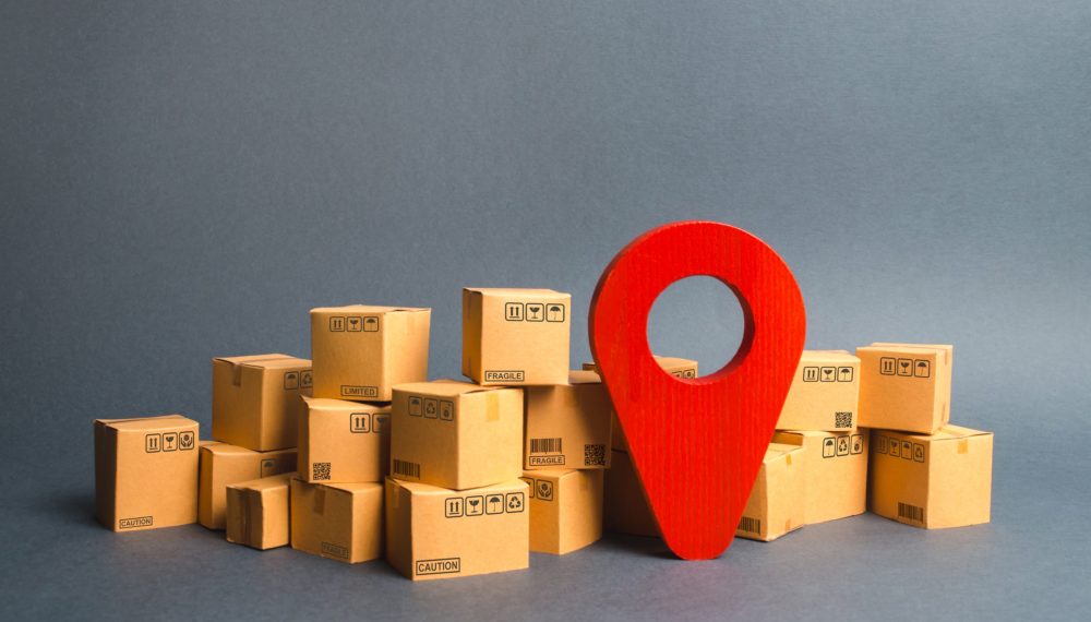 Lots,Of,Cardboard,Boxes,And,A,Red,Position,Pin.,Locating Lots,Of,Cardboard,Boxes,And,A,Red,Position,Pin.,Locating