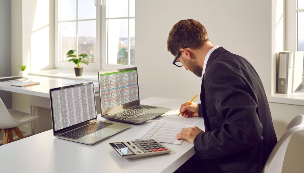 Male,Bookkeeper,Working,With,Financial,Report,In,In,Office.,Man Male,Bookkeeper,Working,With,Financial,Report,In,In,Office.,Man