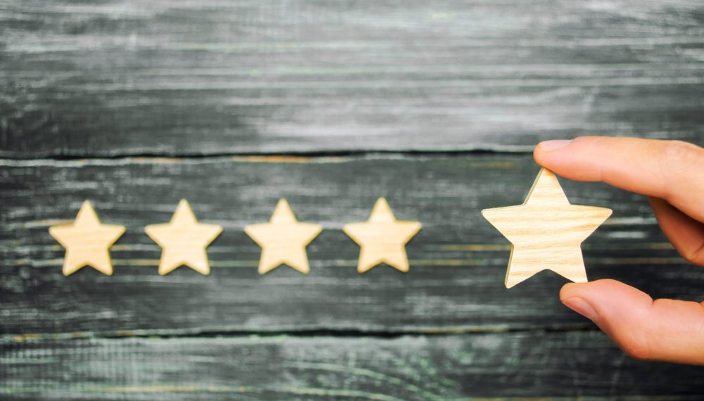 The,Businessman's,Hand,Holds,The,Fifth,Star.,A,New,Star, The,Businessman's,Hand,Holds,The,Fifth,Star.,A,New,Star,