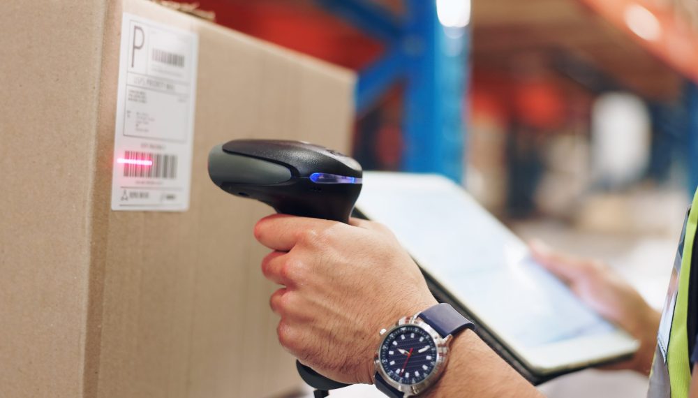 Logistics,,Hands,And,Man,Scanning,Barcode,In,Warehouse,With,Tablet