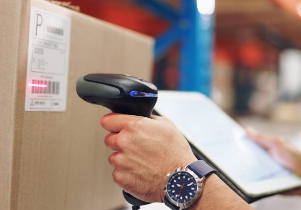 Logistics,,Hands,And,Man,Scanning,Barcode,In,Warehouse,With,Tablet