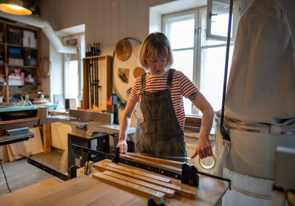 Woman,Carpenter,Prepares,Wooden,Blocks,For,Work,,Apply,Tape,Before Woman,Carpenter,Prepares,Wooden,Blocks,For,Work,,Apply,Tape,Before