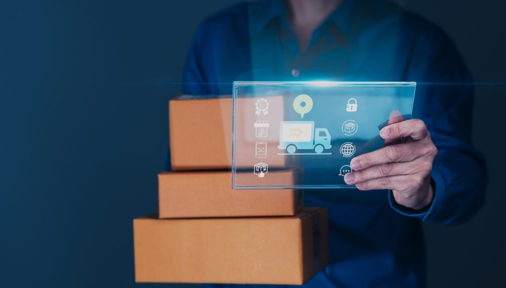Man,Tracks,His,Shipment,With,A,Tablet,Displaying,A,Package