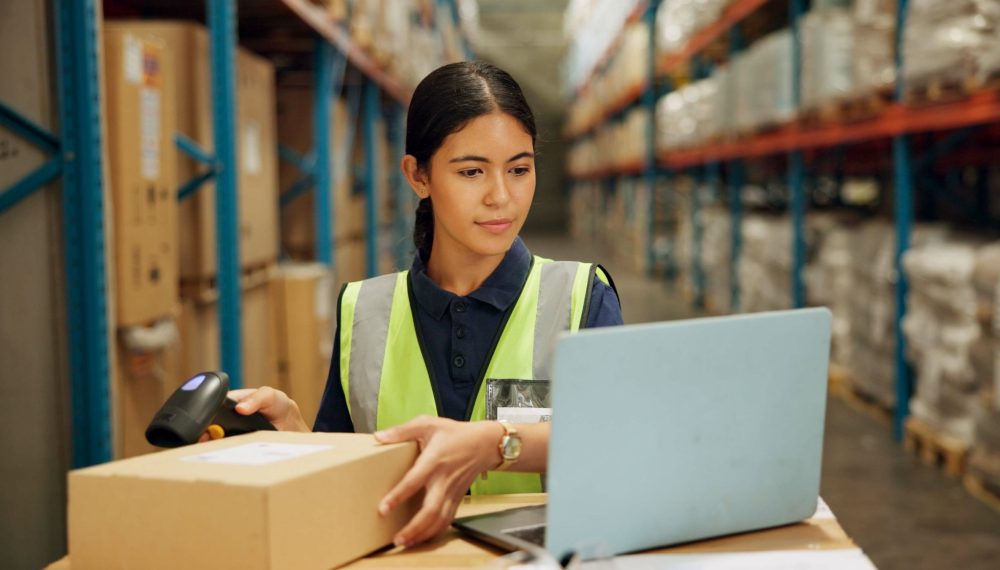 Laptop,,Qr,Code,And,Inventory,With,Woman,Scanning,Box,In Laptop,,Qr,Code,And,Inventory,With,Woman,Scanning,Box,In