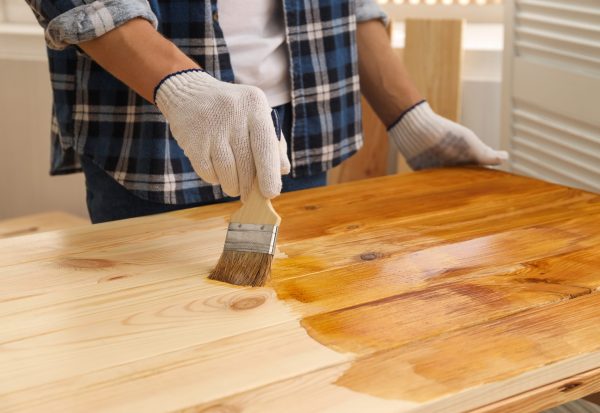 Man,With,Brush,Applying,Wood,Stain,Onto,Wooden,Surface,Indoors, Man,With,Brush,Applying,Wood,Stain,Onto,Wooden,Surface,Indoors,