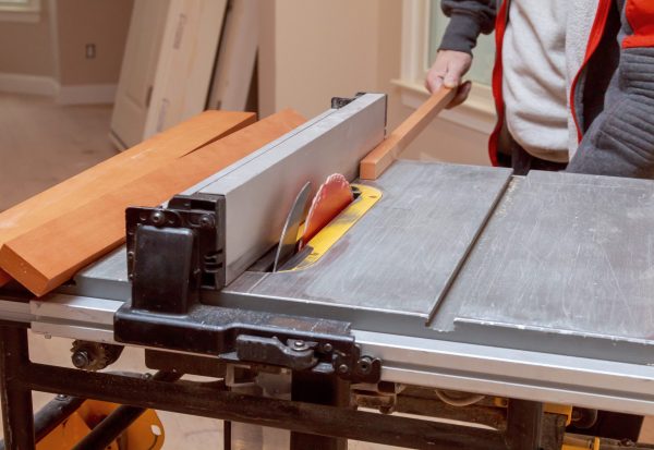 Using,An,Electric,Table,Saw,To,Cut,Wood,Cabinet,Filler Using,An,Electric,Table,Saw,To,Cut,Wood,Cabinet,Filler