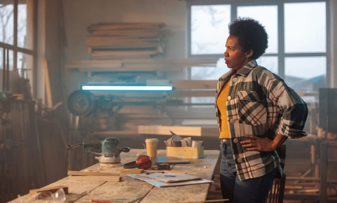 A,Stressed,Female,African,American,Carpenter,Is,In,Her,Workshop,