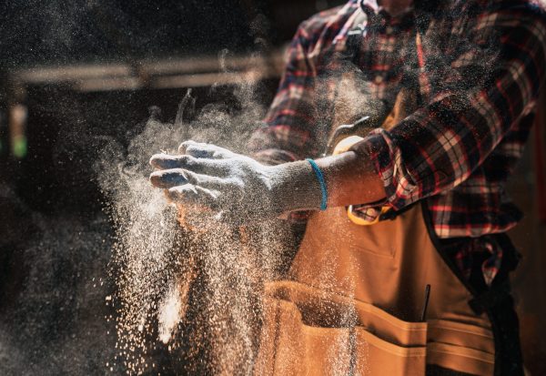 Close,Up,Skilled,African,American,Carpenter,Dusts,Gloves,In,Woodshop Close,Up,Skilled,African,American,Carpenter,Dusts,Gloves,In,Woodshop