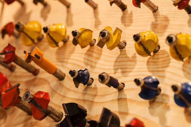 Wood router bits organized for beginners learning woodworking techniques
