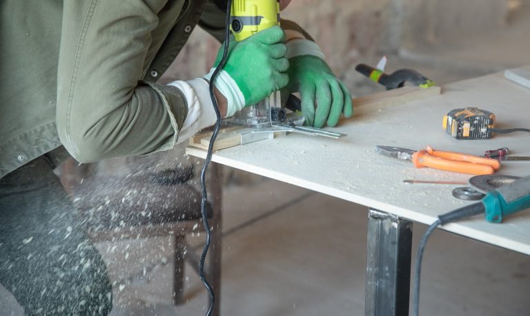 Beginner woodworking project using a router tool to create precise wood cuts