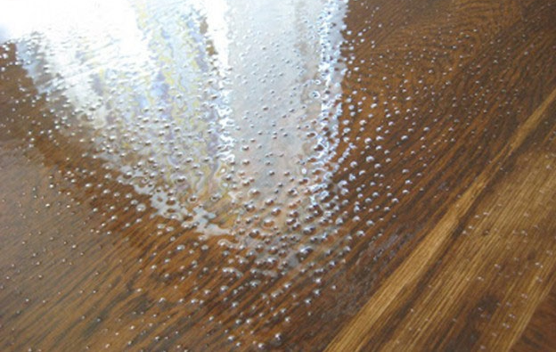 Polyurethane wood coating process showing protective finish applied to a wooden surface